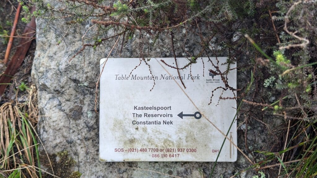 a sign on a rock