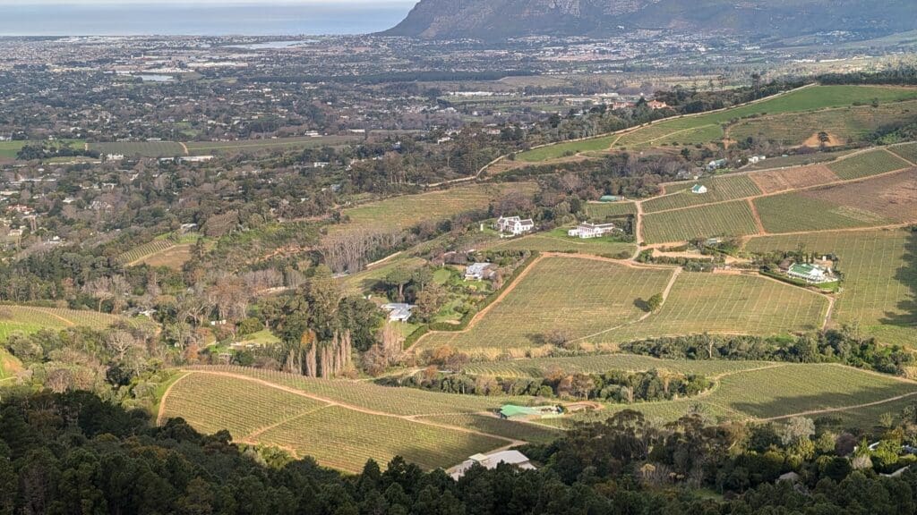 a landscape with a hill and a city