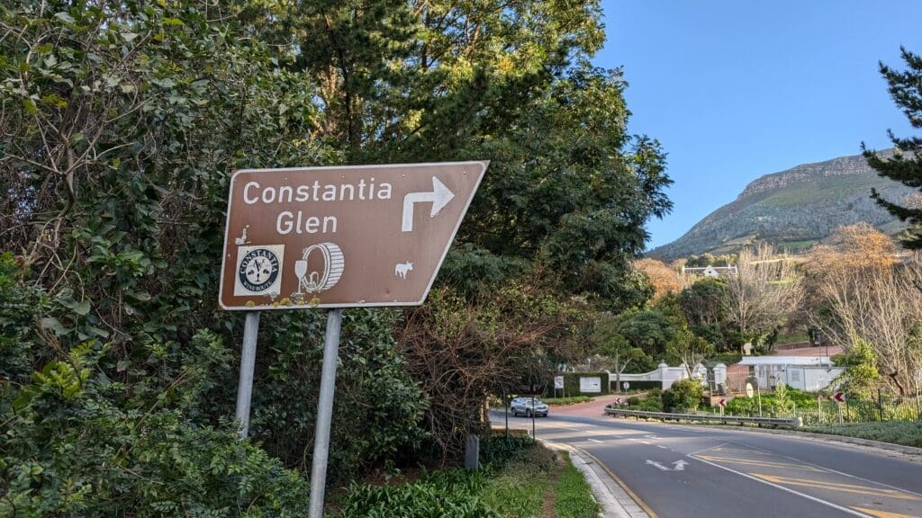 a sign on a pole next to a road