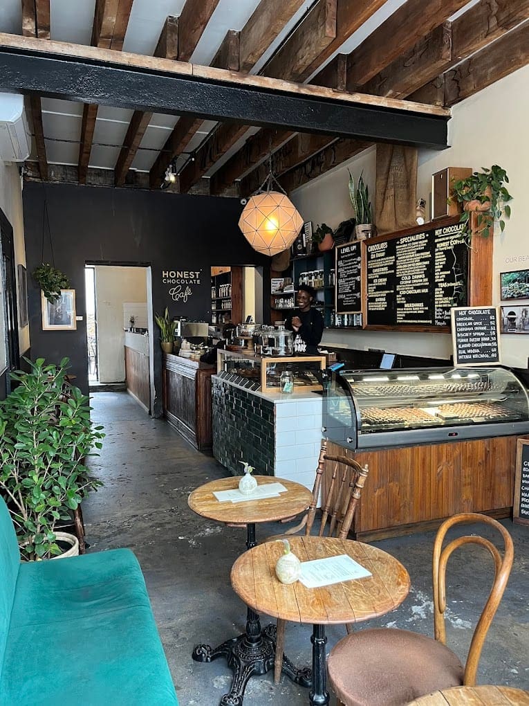 a coffee shop with a counter and tables