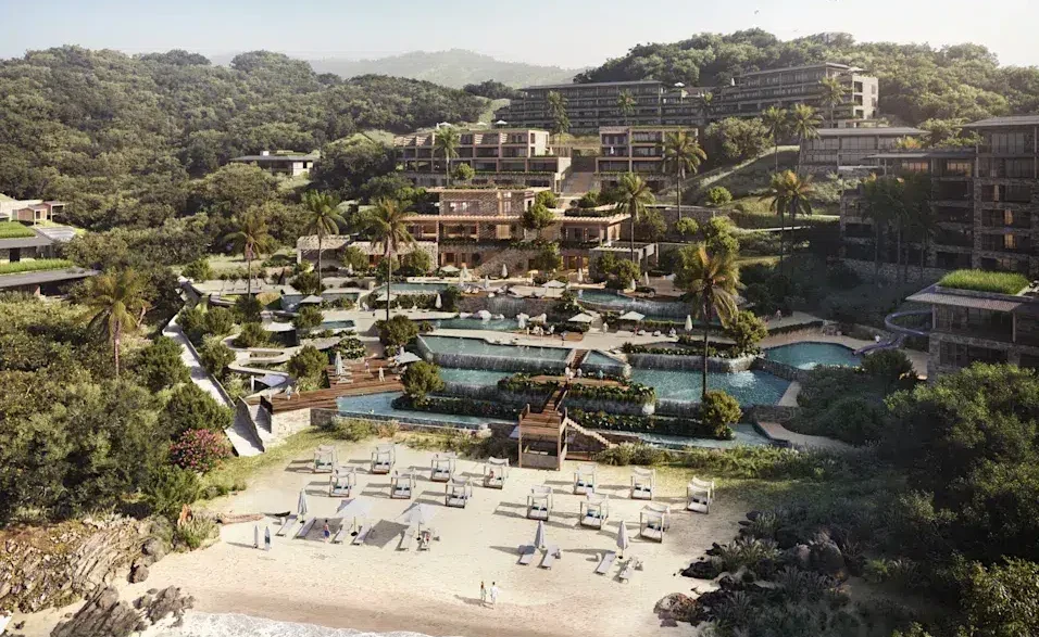 a resort with a pool and a beach