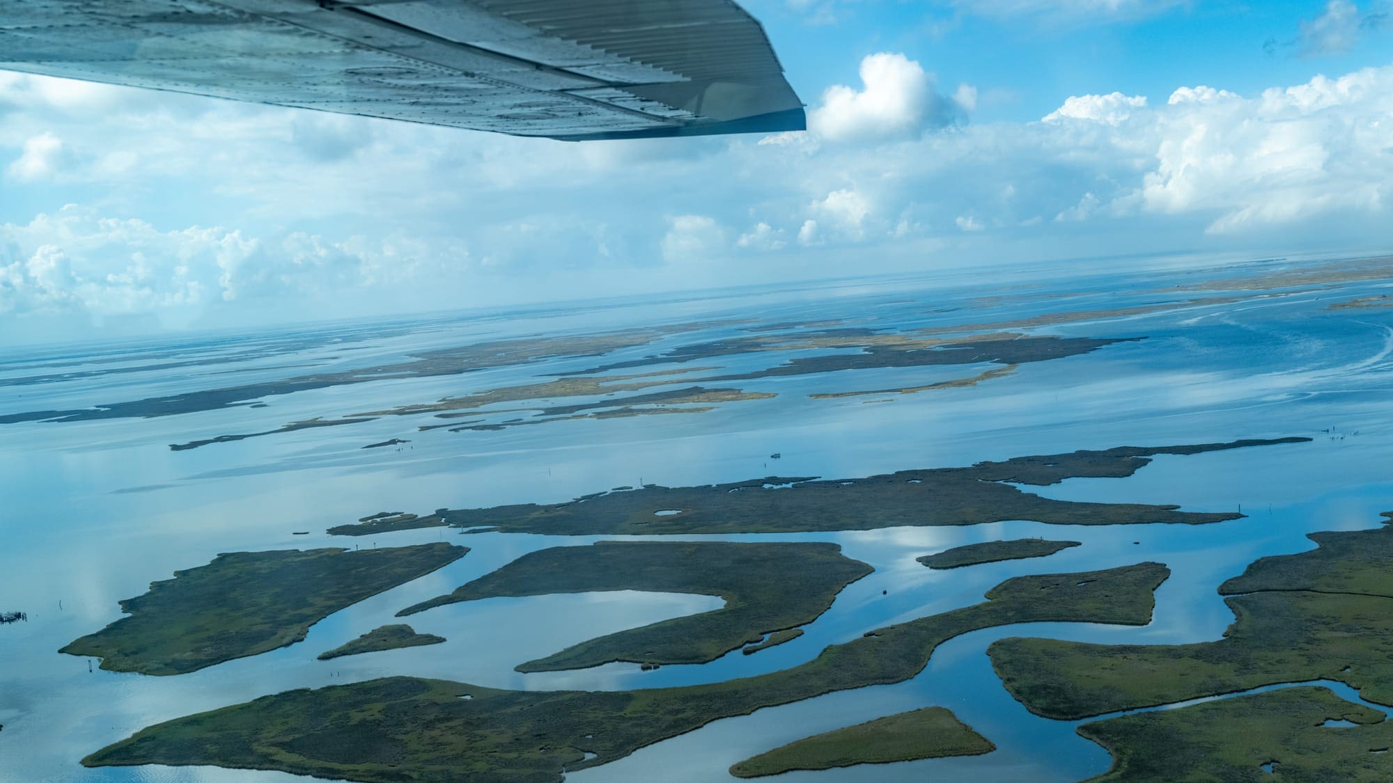 an aerial view of land and water