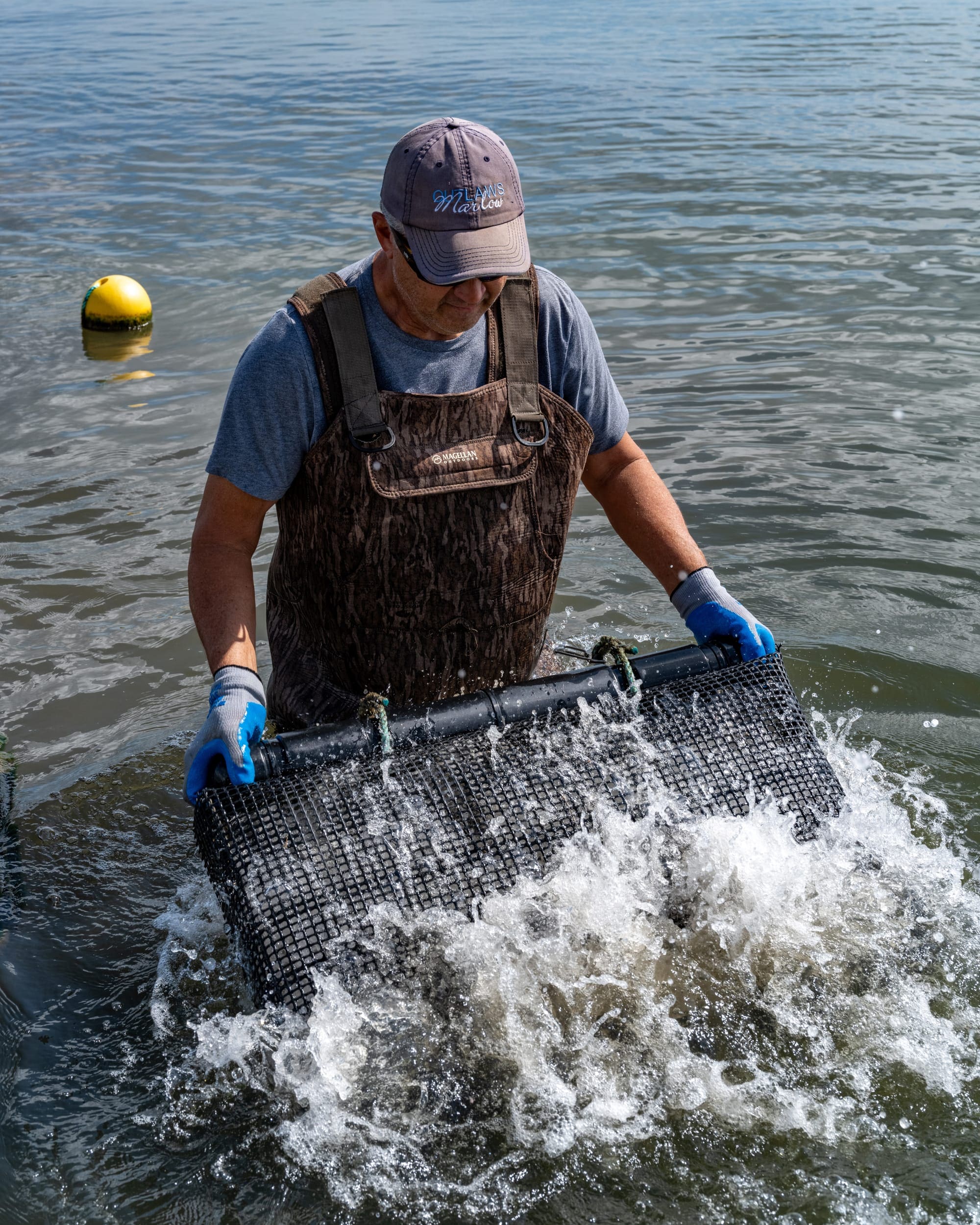 a man holding a net in the water