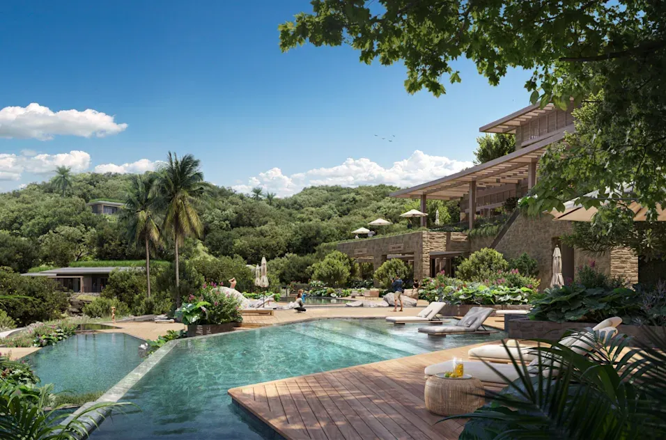 a pool with a building and trees