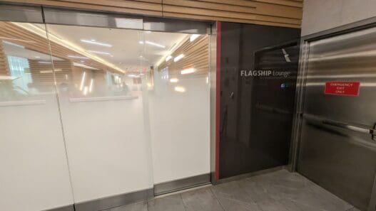 a glass doors with a sign on the side
