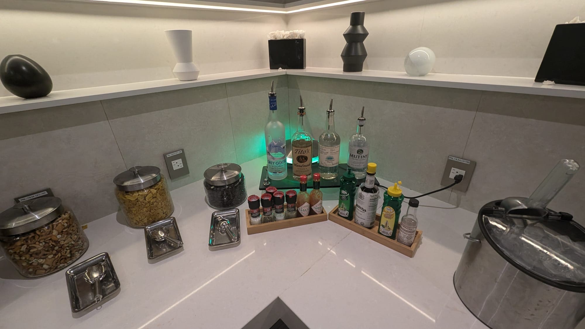 a counter with bottles and spices on it