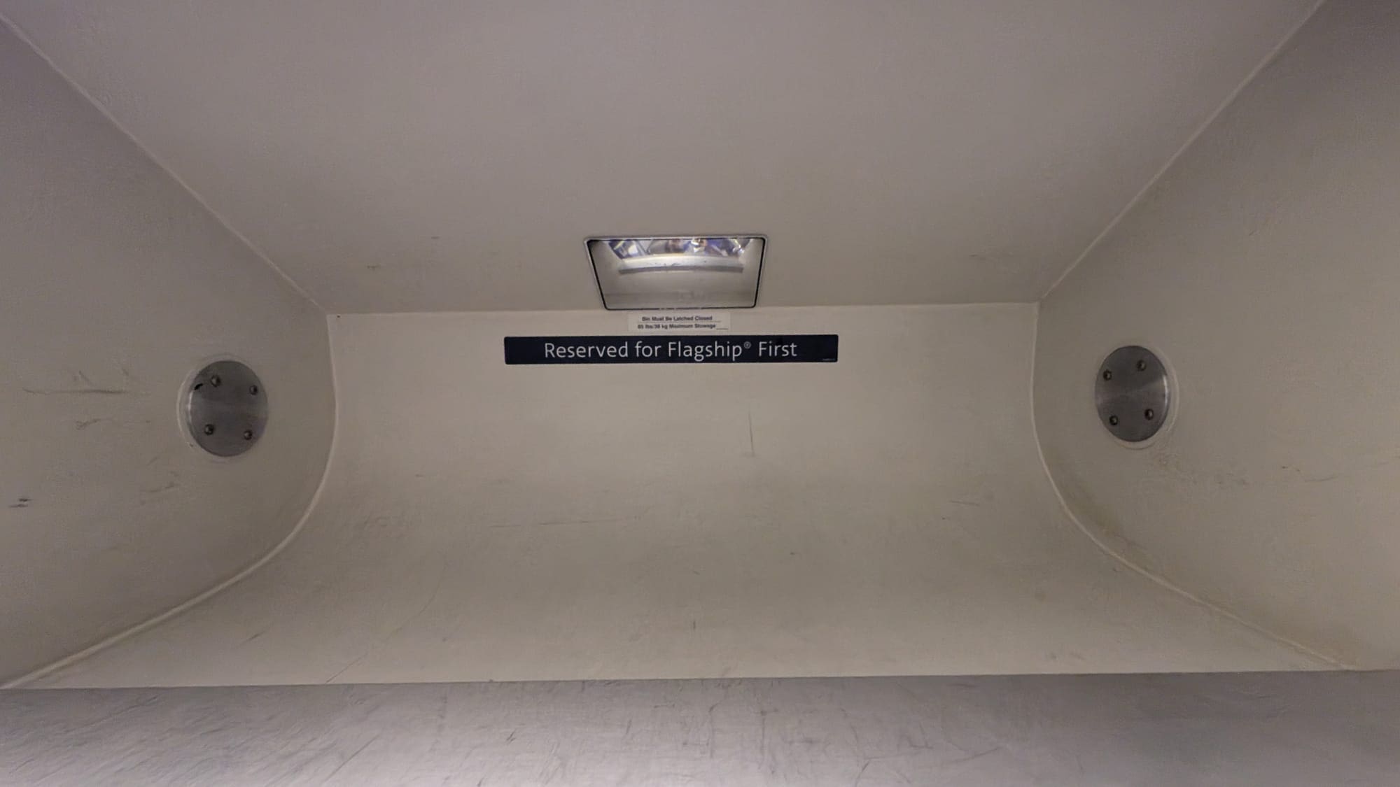 Photo of open overhead compartment