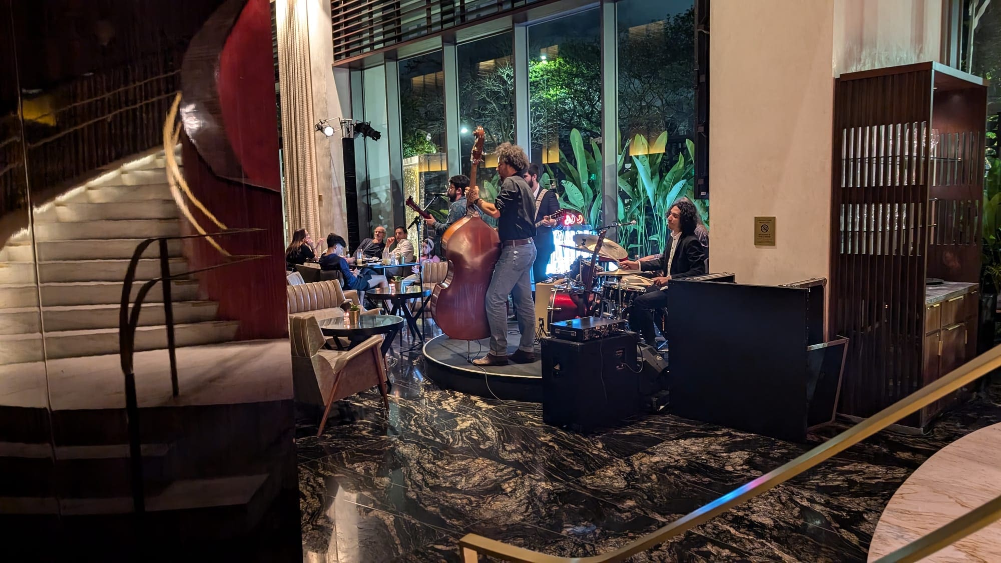 a group of people playing instruments in a room