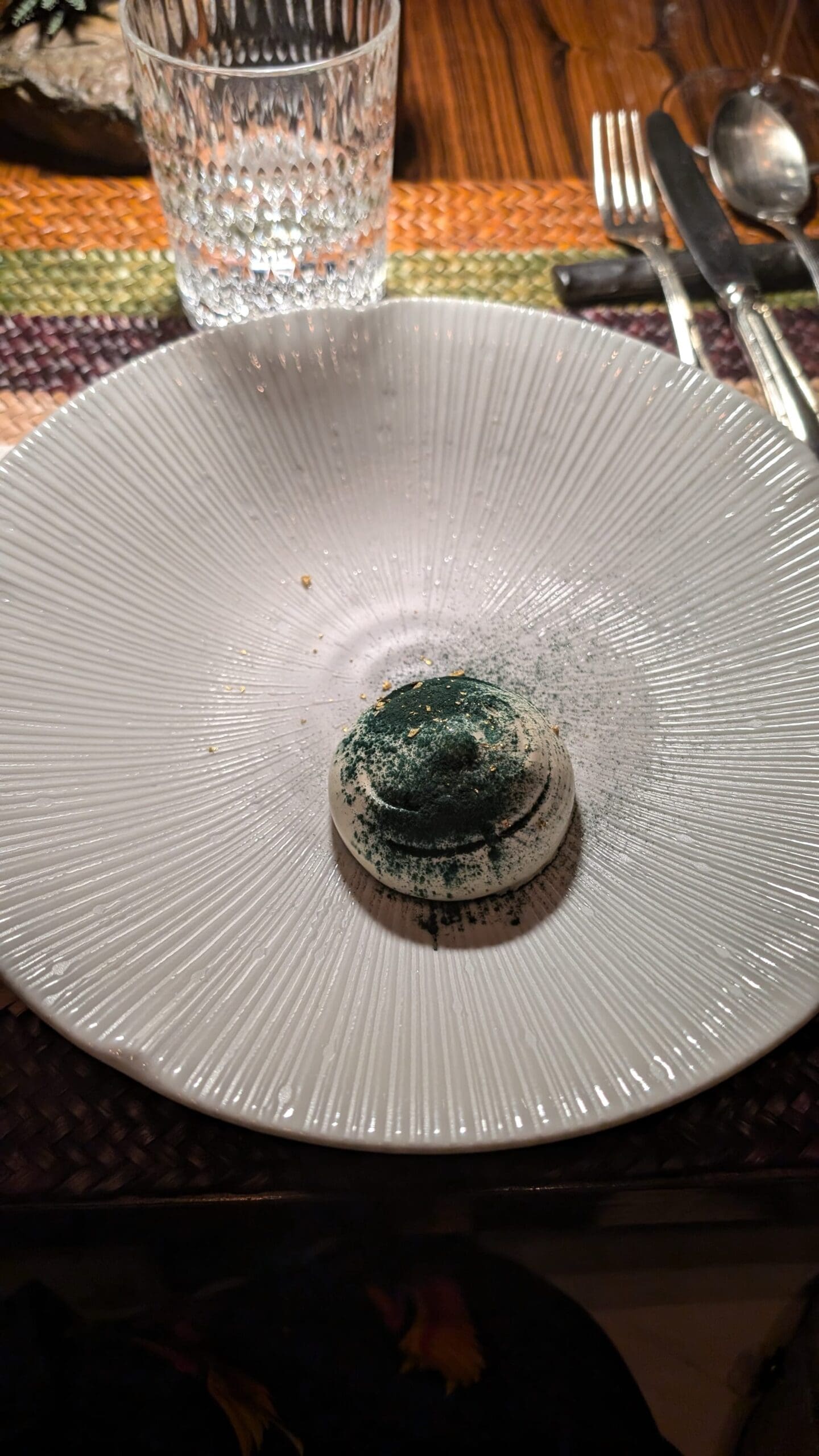 a white plate with green powder on it