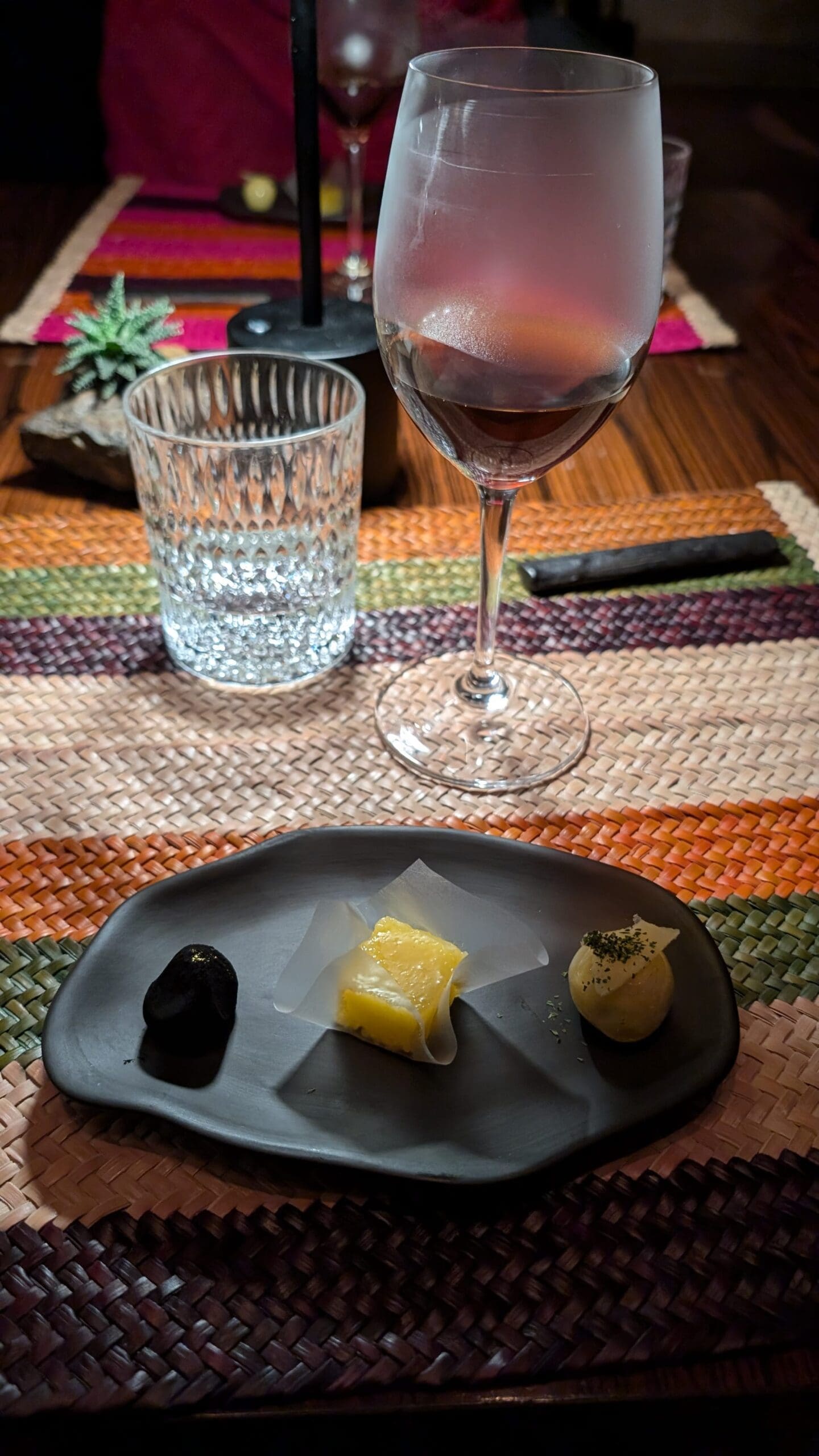 a plate of food and a glass of wine
