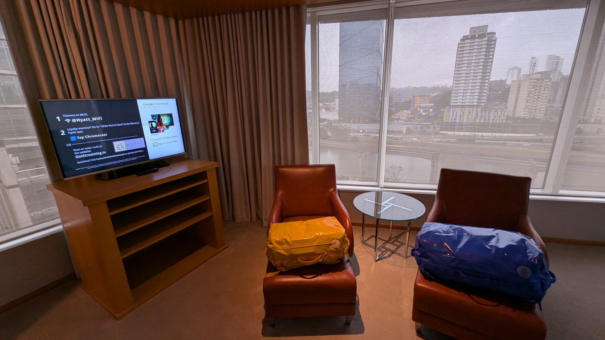 a room with a television and chairs
