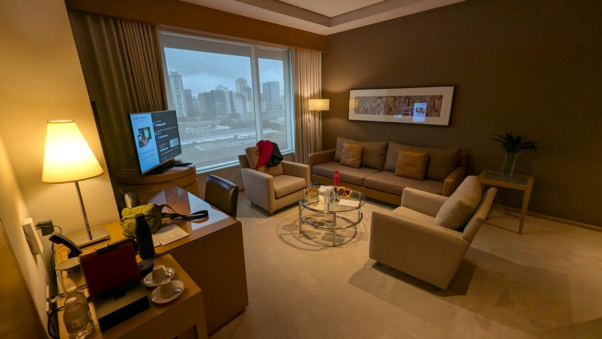 a living room with a television and couches