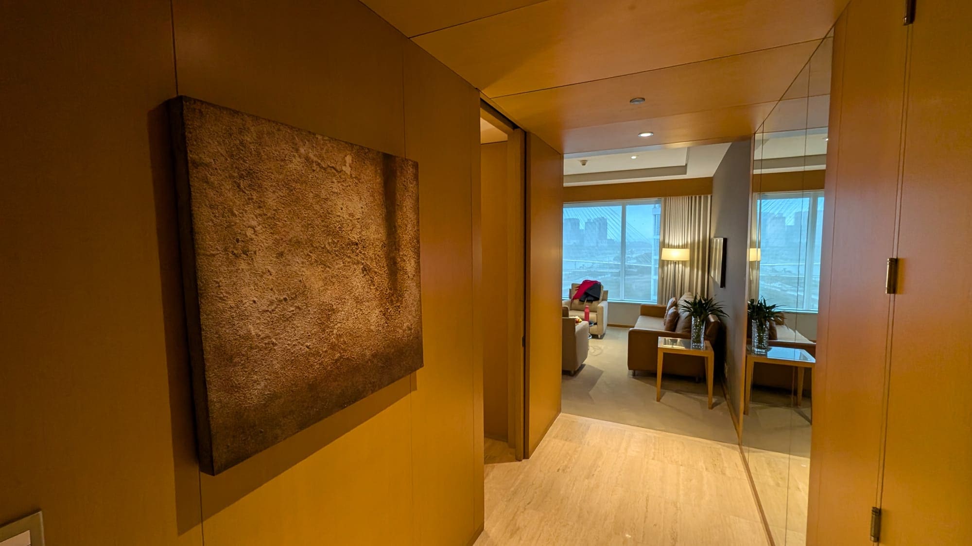 a room with a painting on the wall