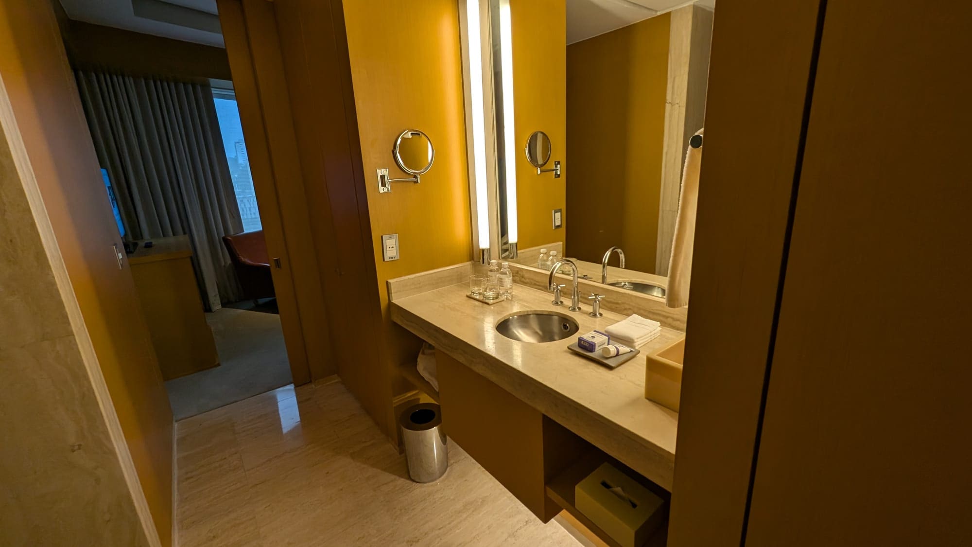 a bathroom with a mirror and sink
