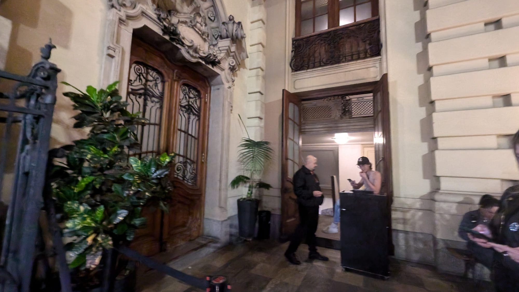 a man standing in front of a woman standing in front of a door