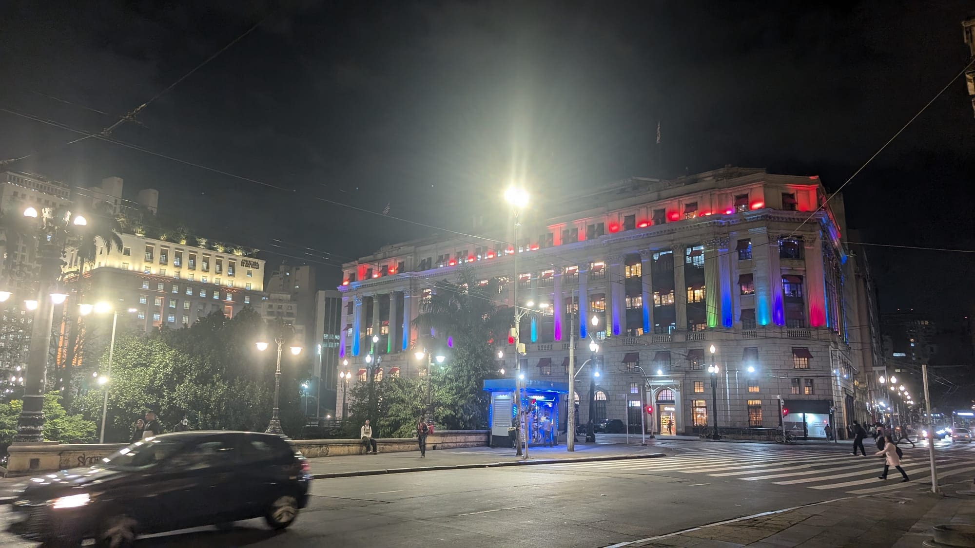 a building with colorful lights at night