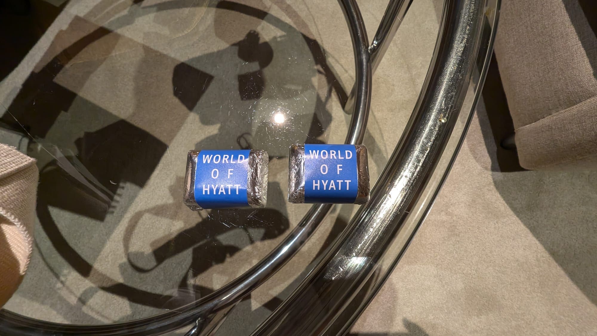 two small blue and white objects on a glass table