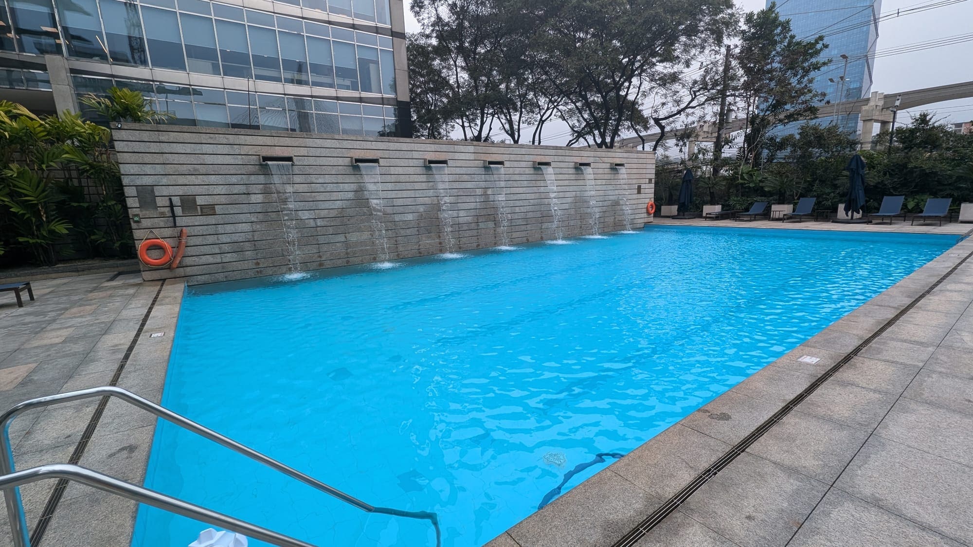 a pool with water falling out of it