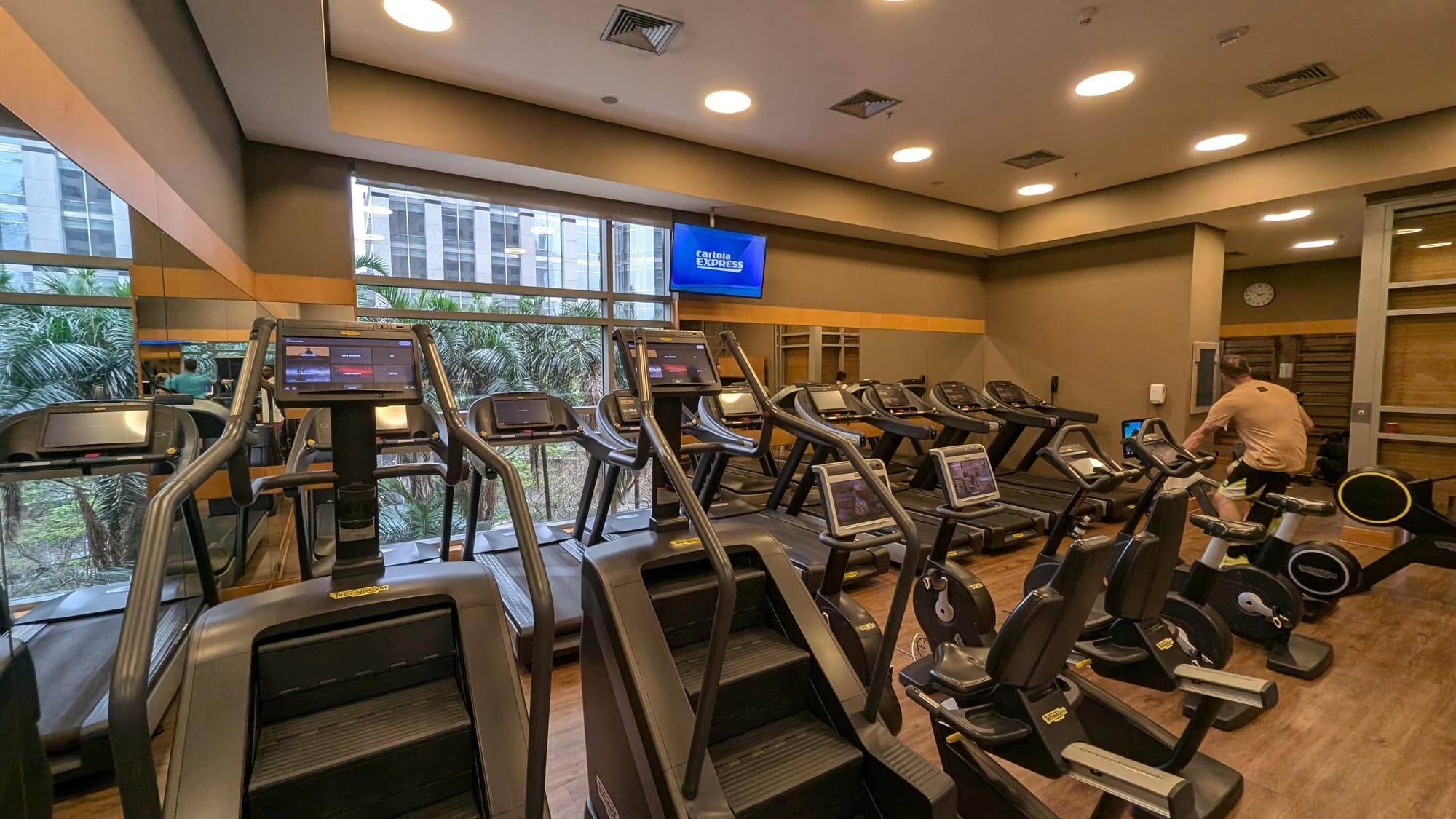 a room with treadmills and a large window