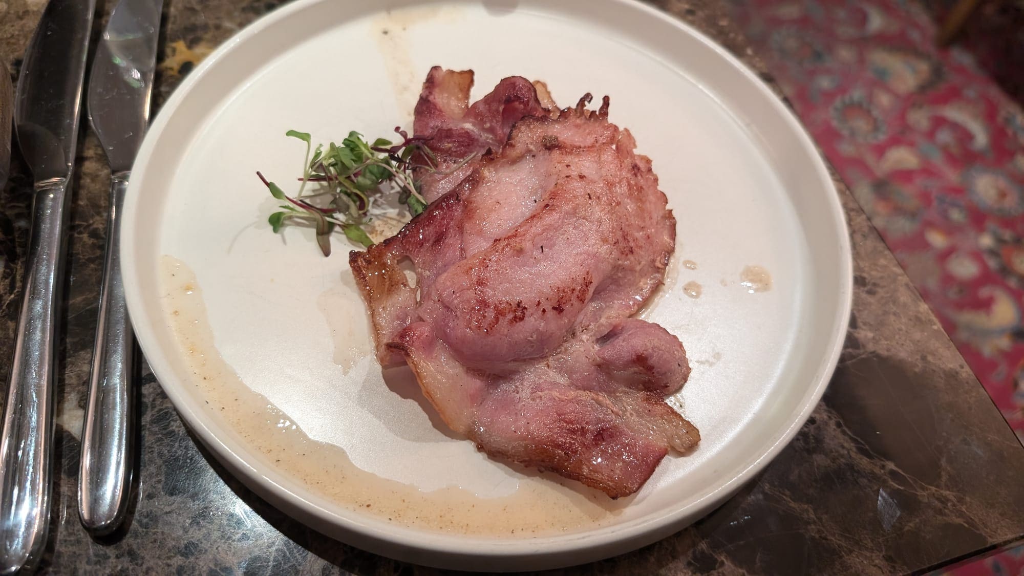 a plate of food on a marble surface
