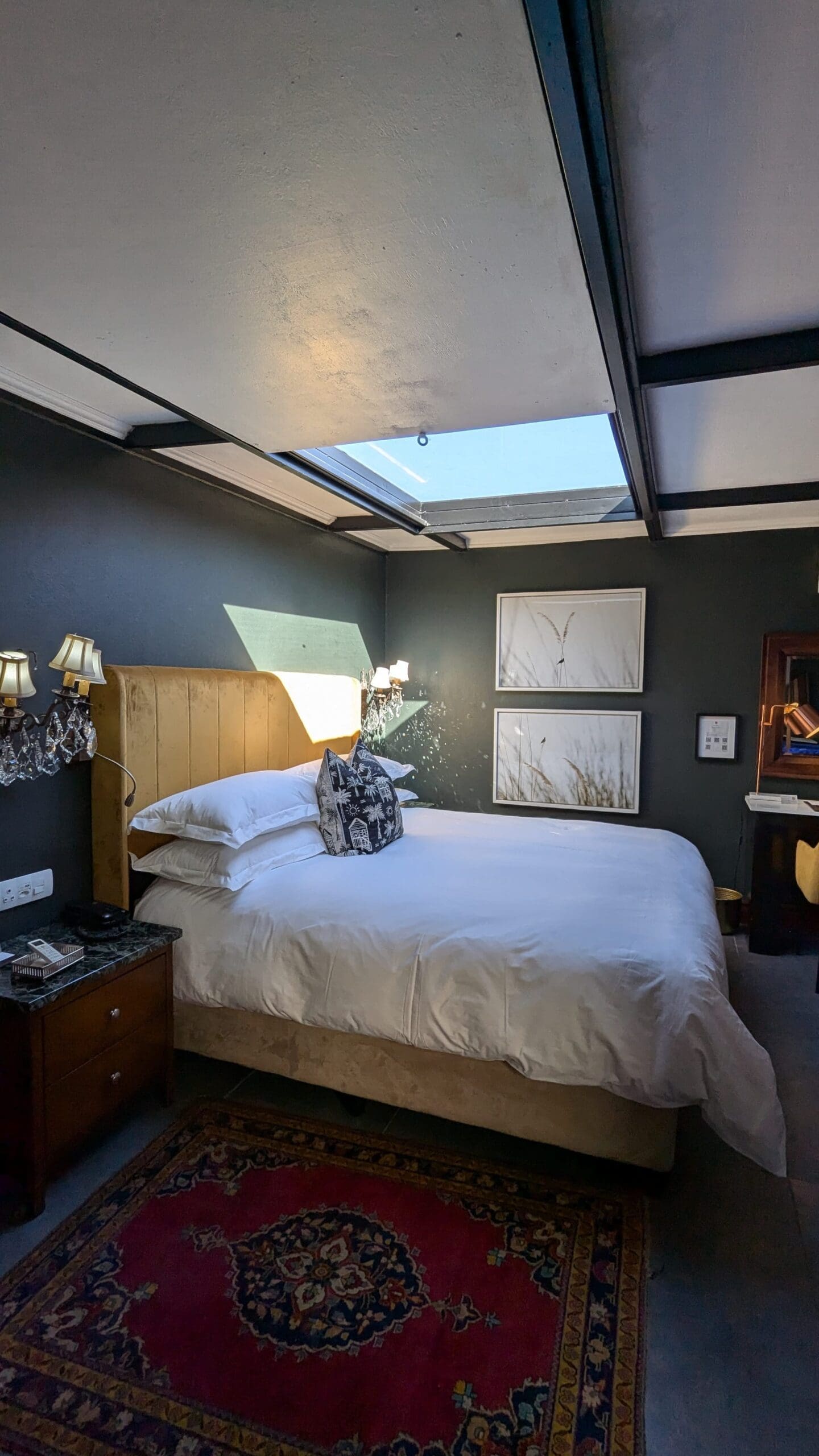a bedroom with a skylight