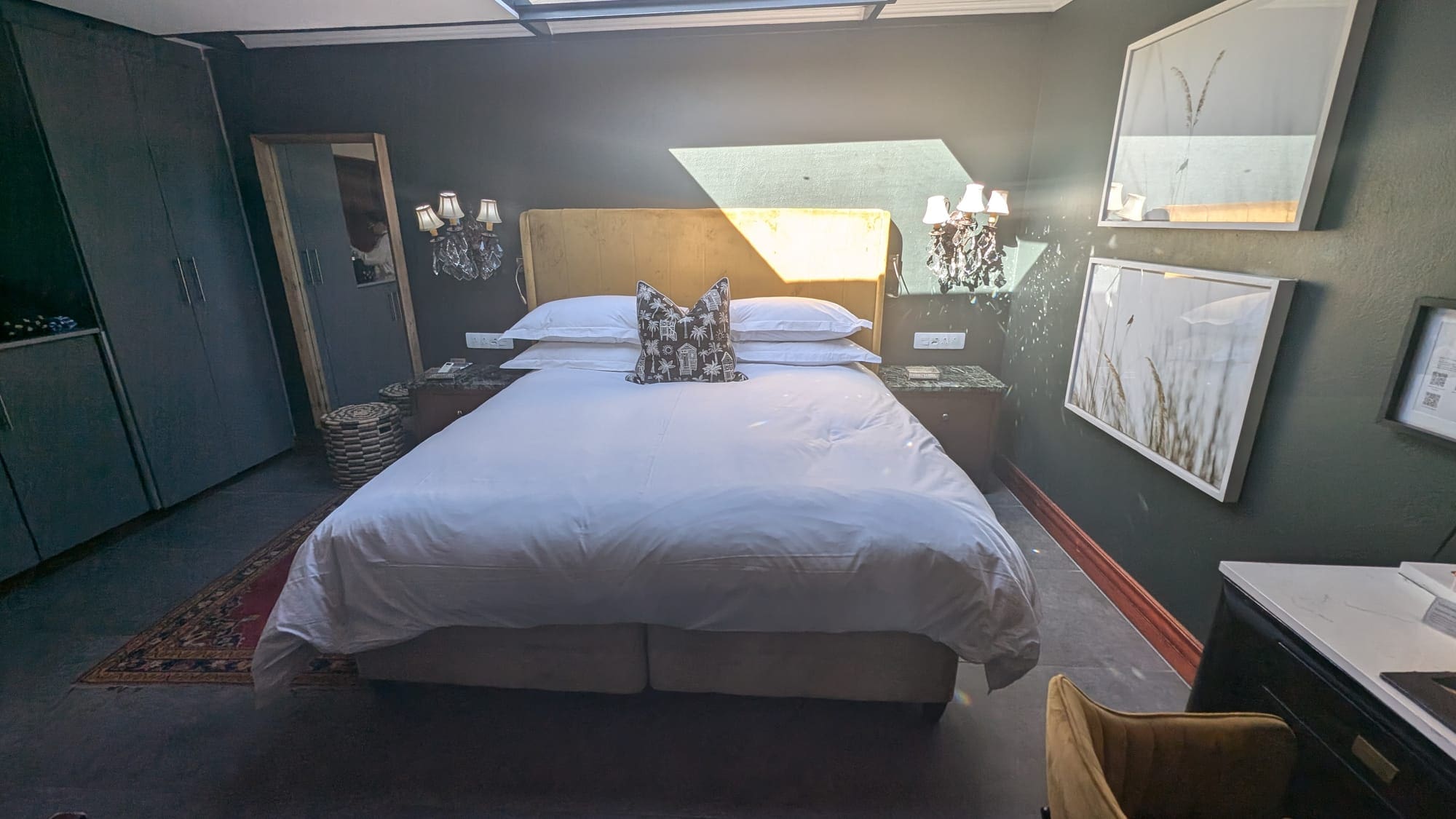 a bed with pillows in a room