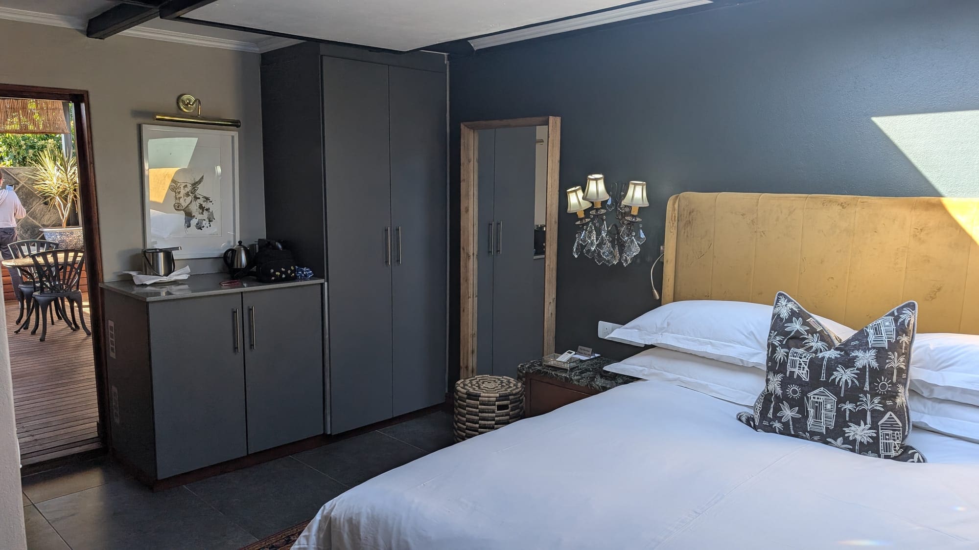 a bedroom with a bed and cupboards