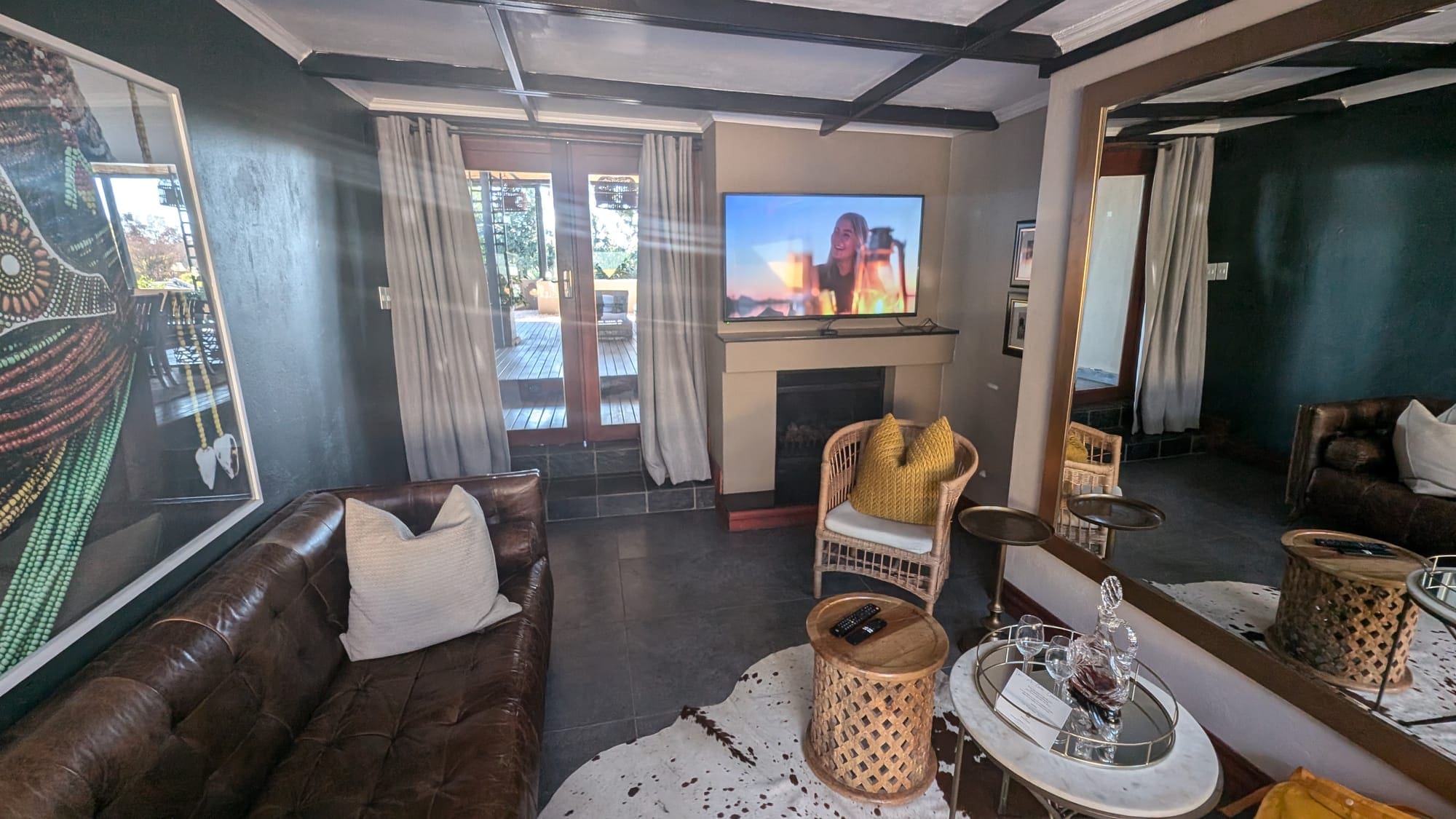 a living room with a television and a fireplace