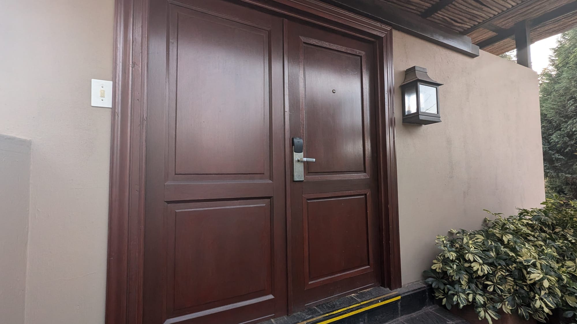 a double doors with a light on the side