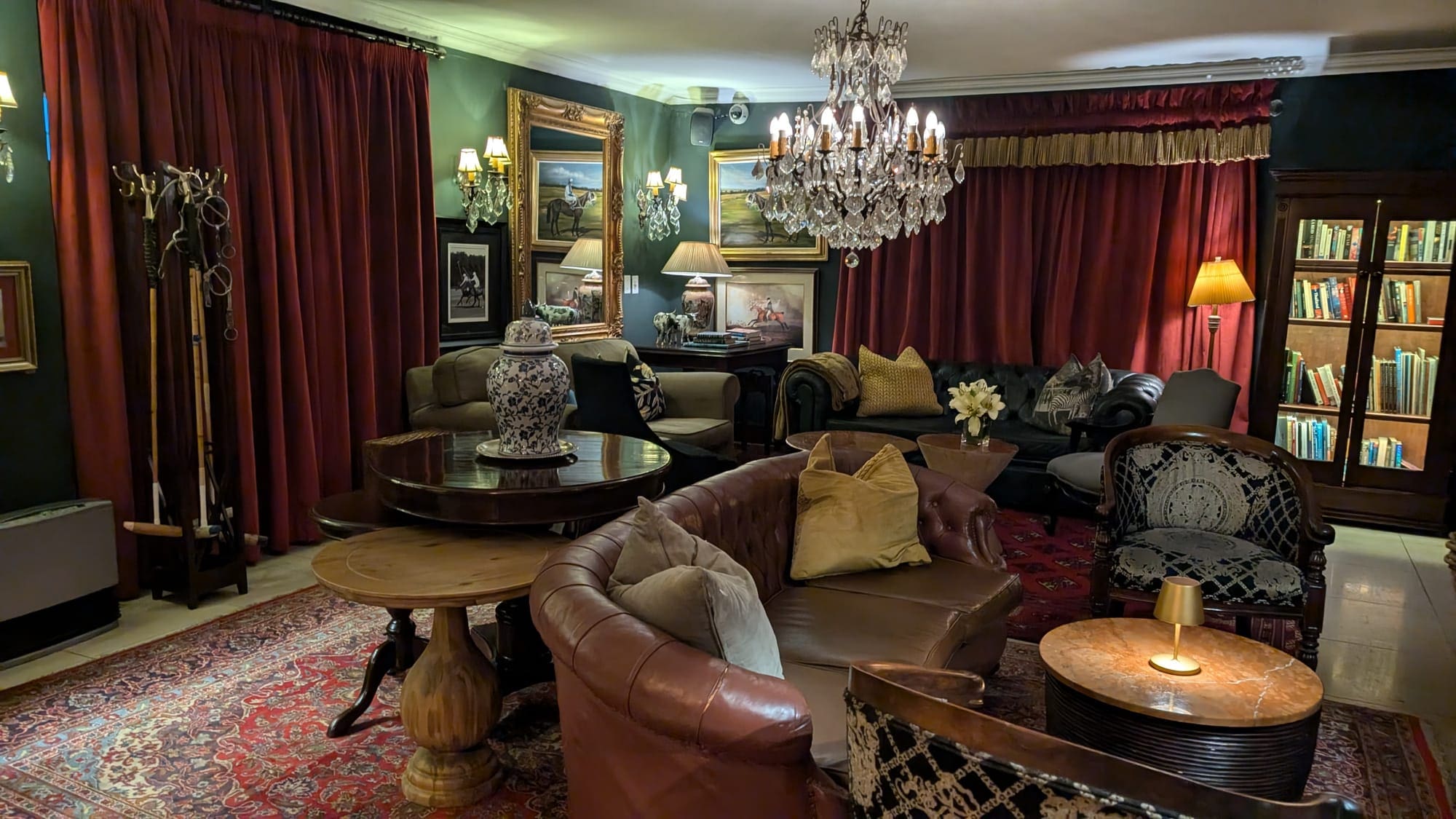 a room with a chandelier and couches