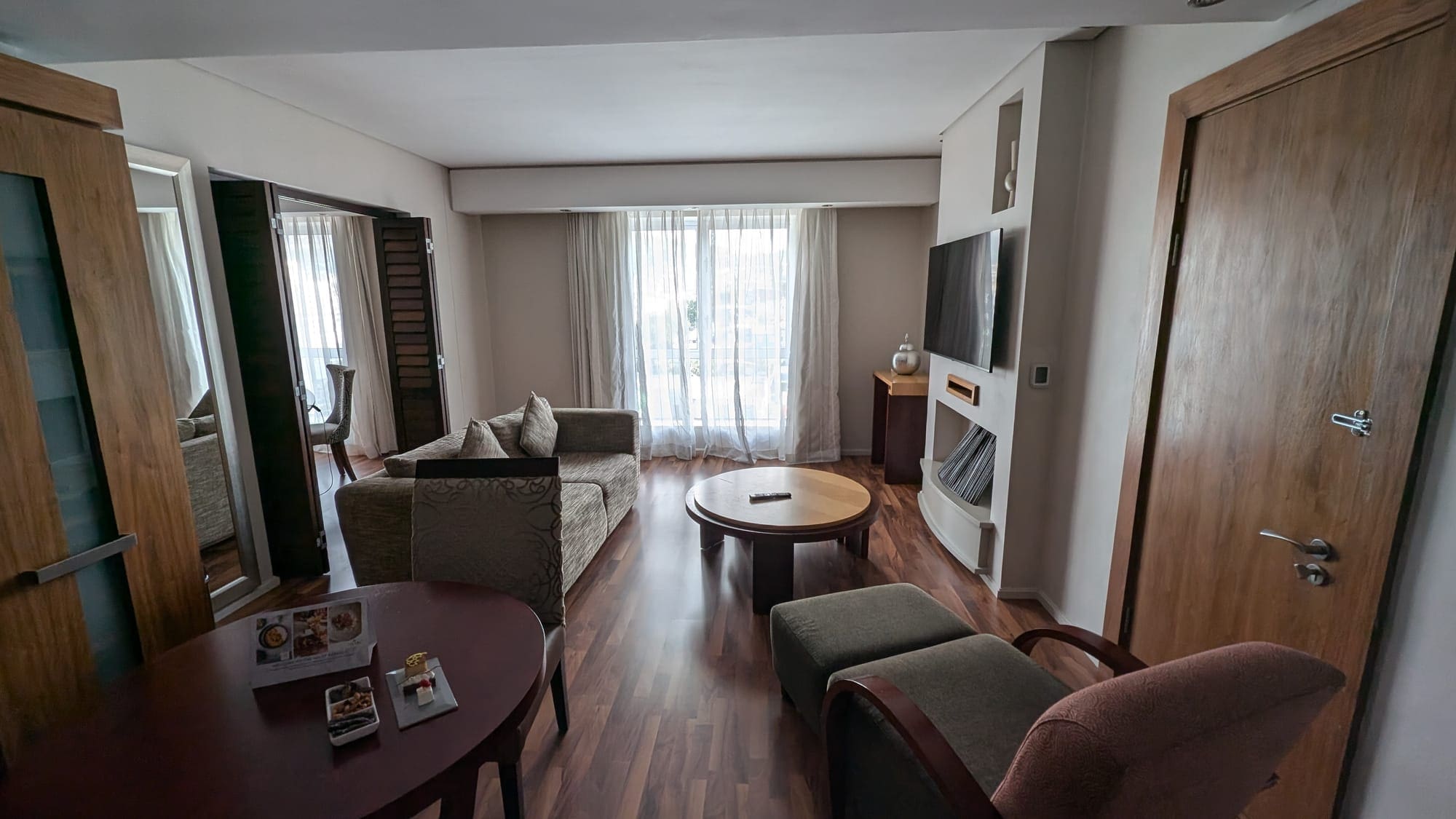 a living room with couches and a tv