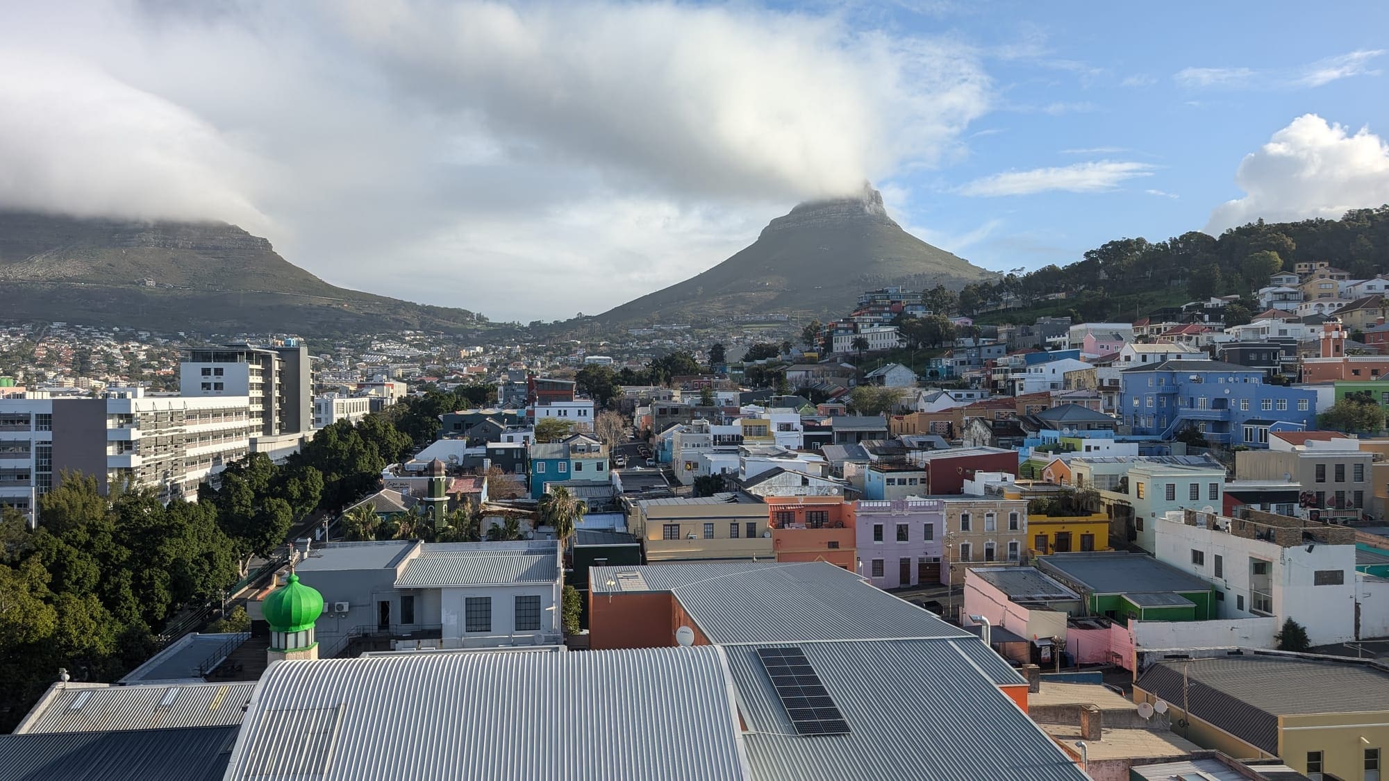 a city with a mountain in the background