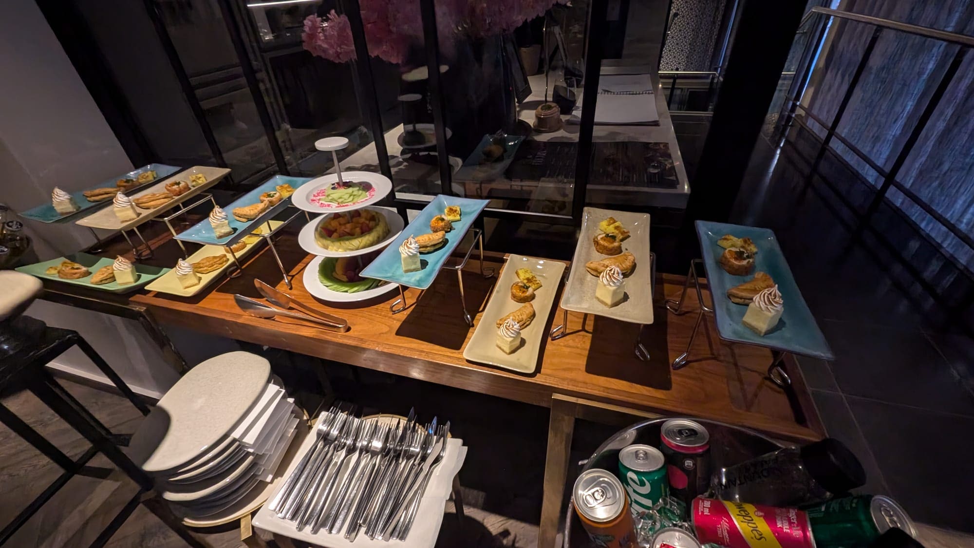 a table with plates of food and drinks