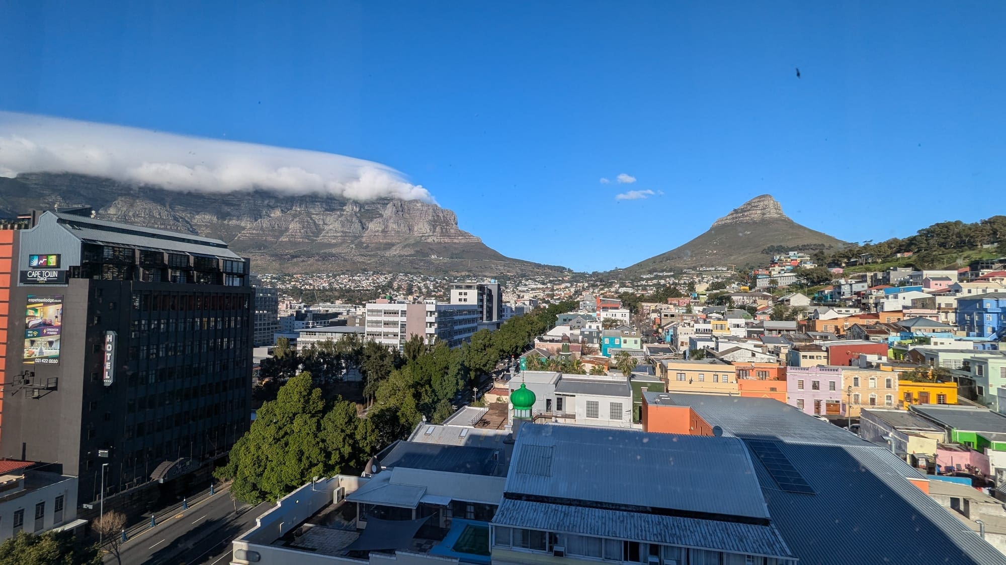a city with a mountain in the background