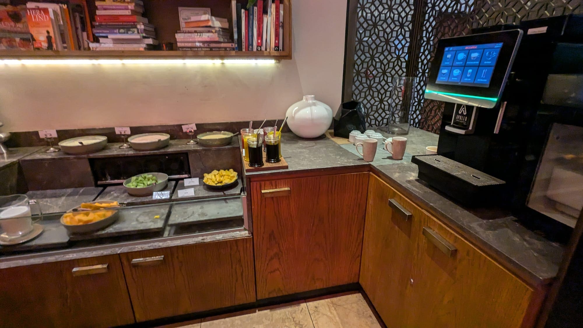 a kitchen with a counter top and a television