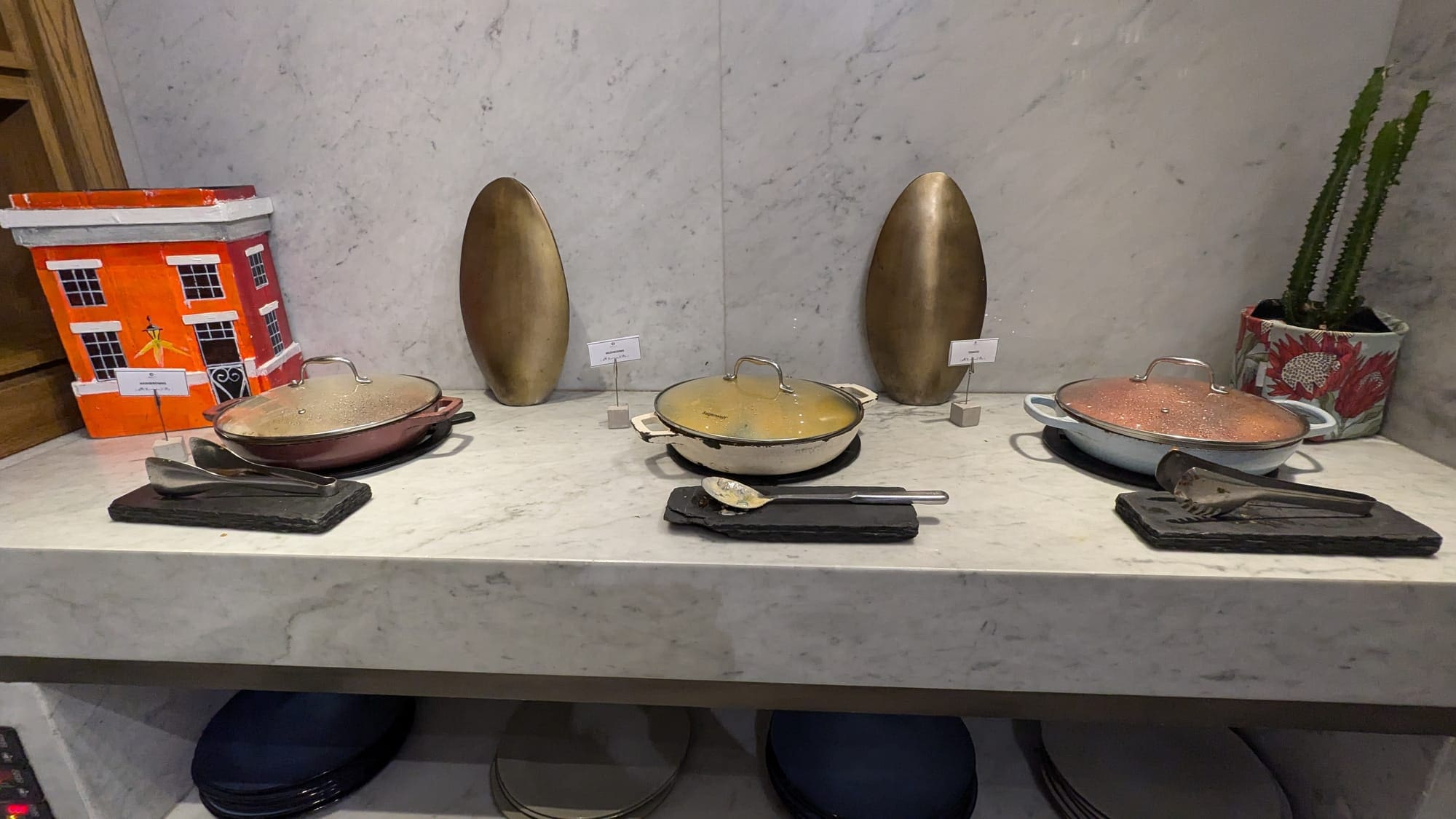 a group of pots on a counter