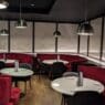 a room with tables and chairs