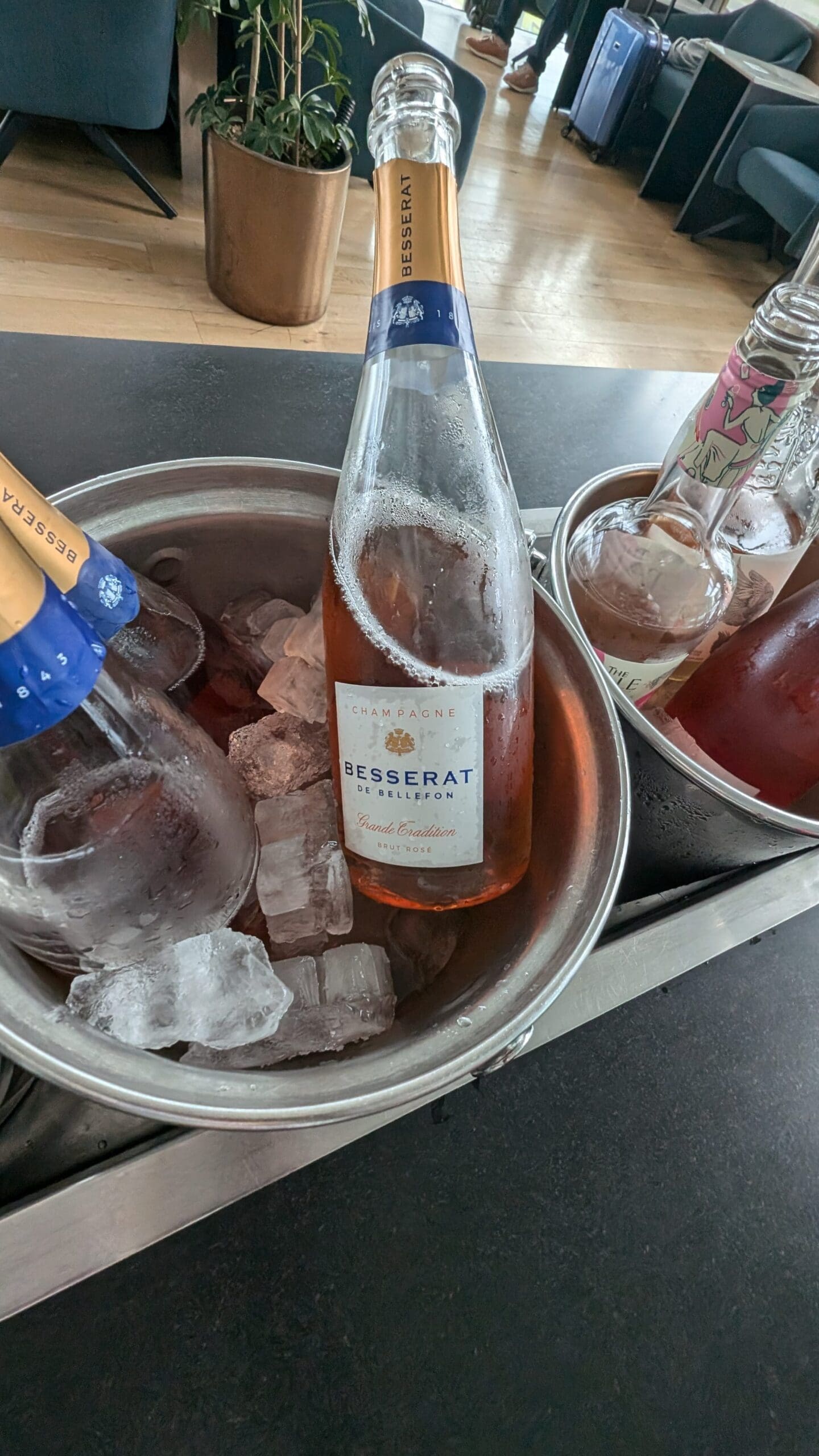 a bucket of ice and bottles of alcohol