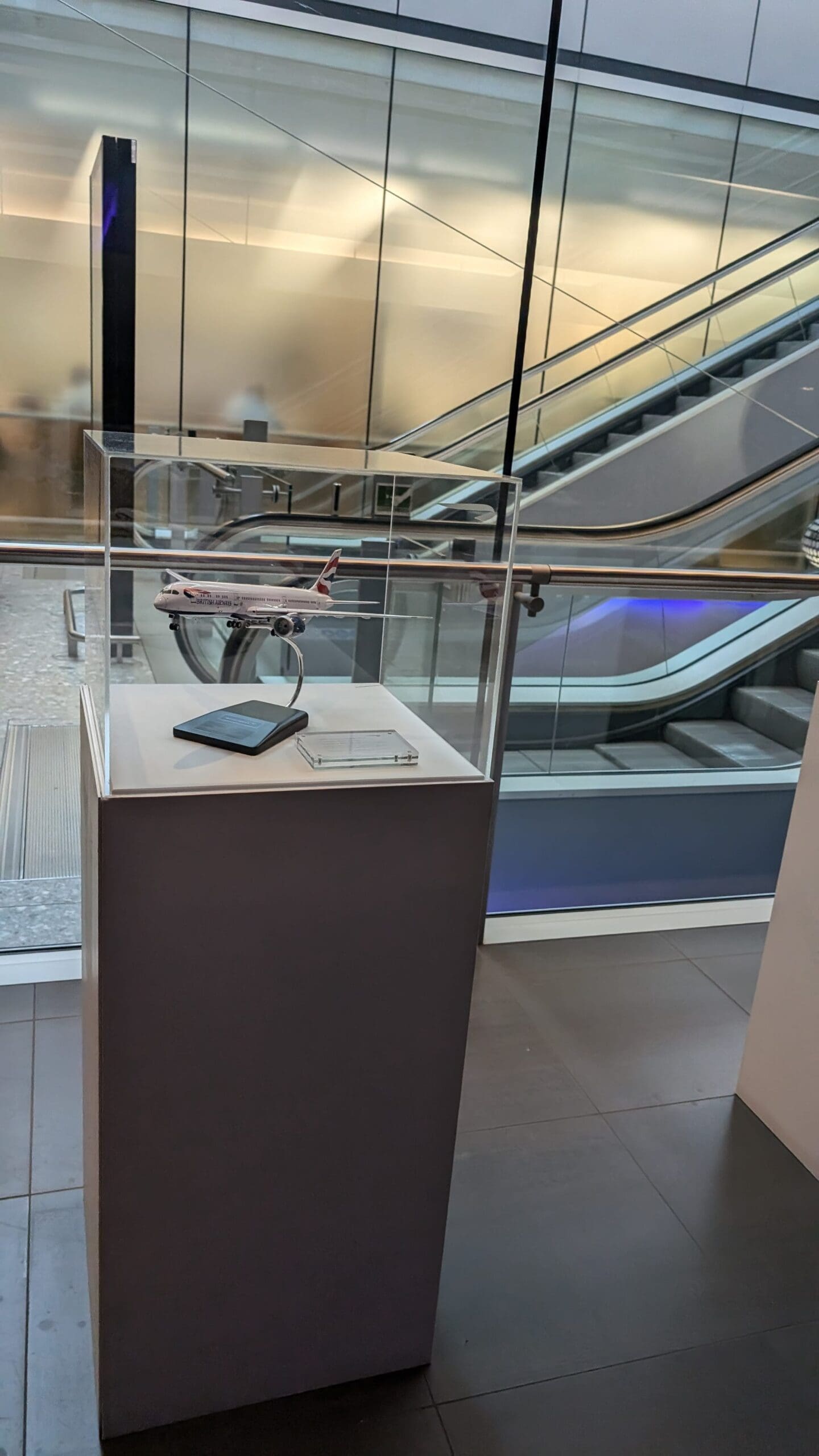 a model airplane in a glass case