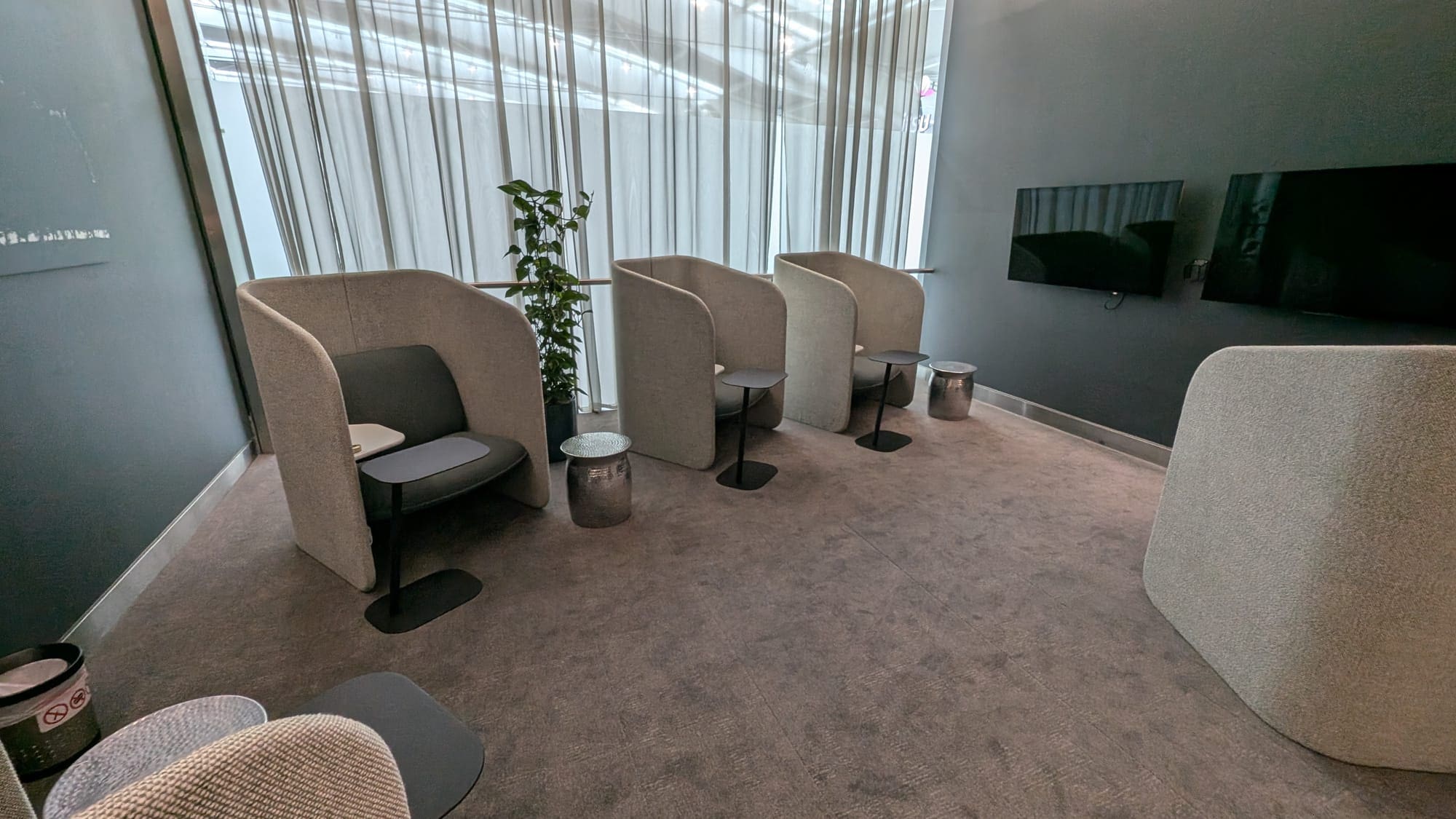 a room with chairs and a tv