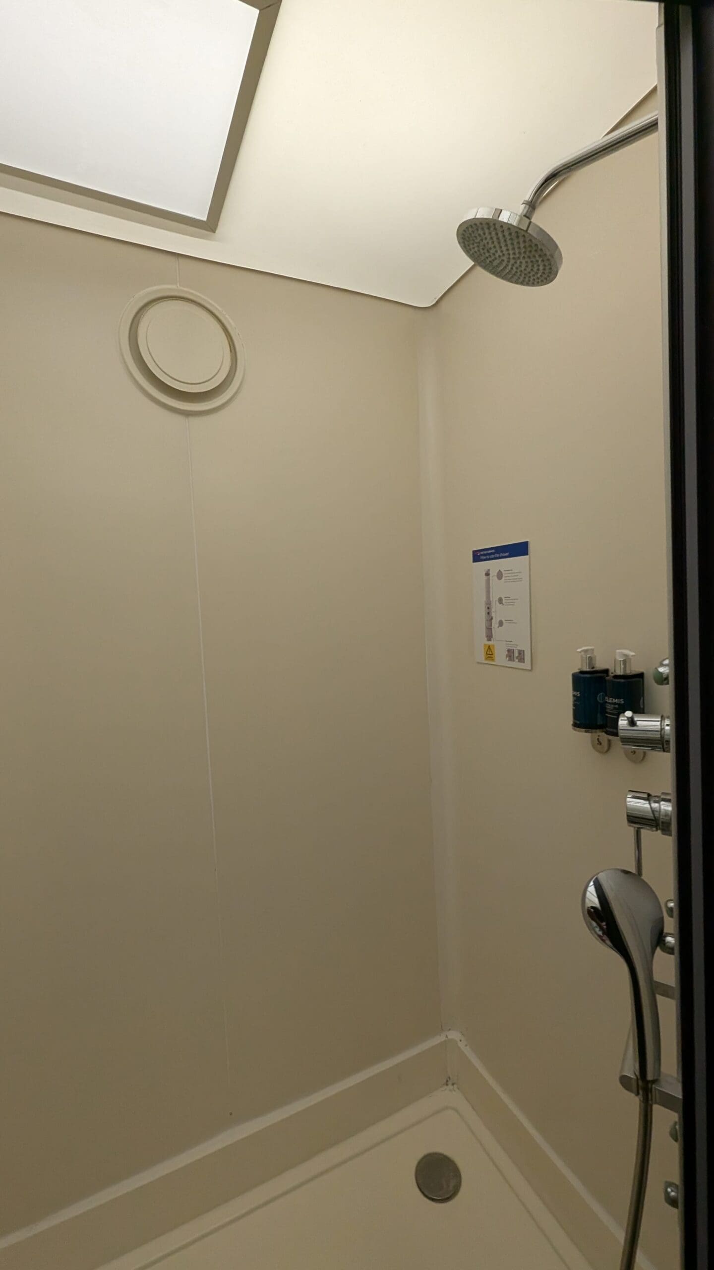 a shower with a round window