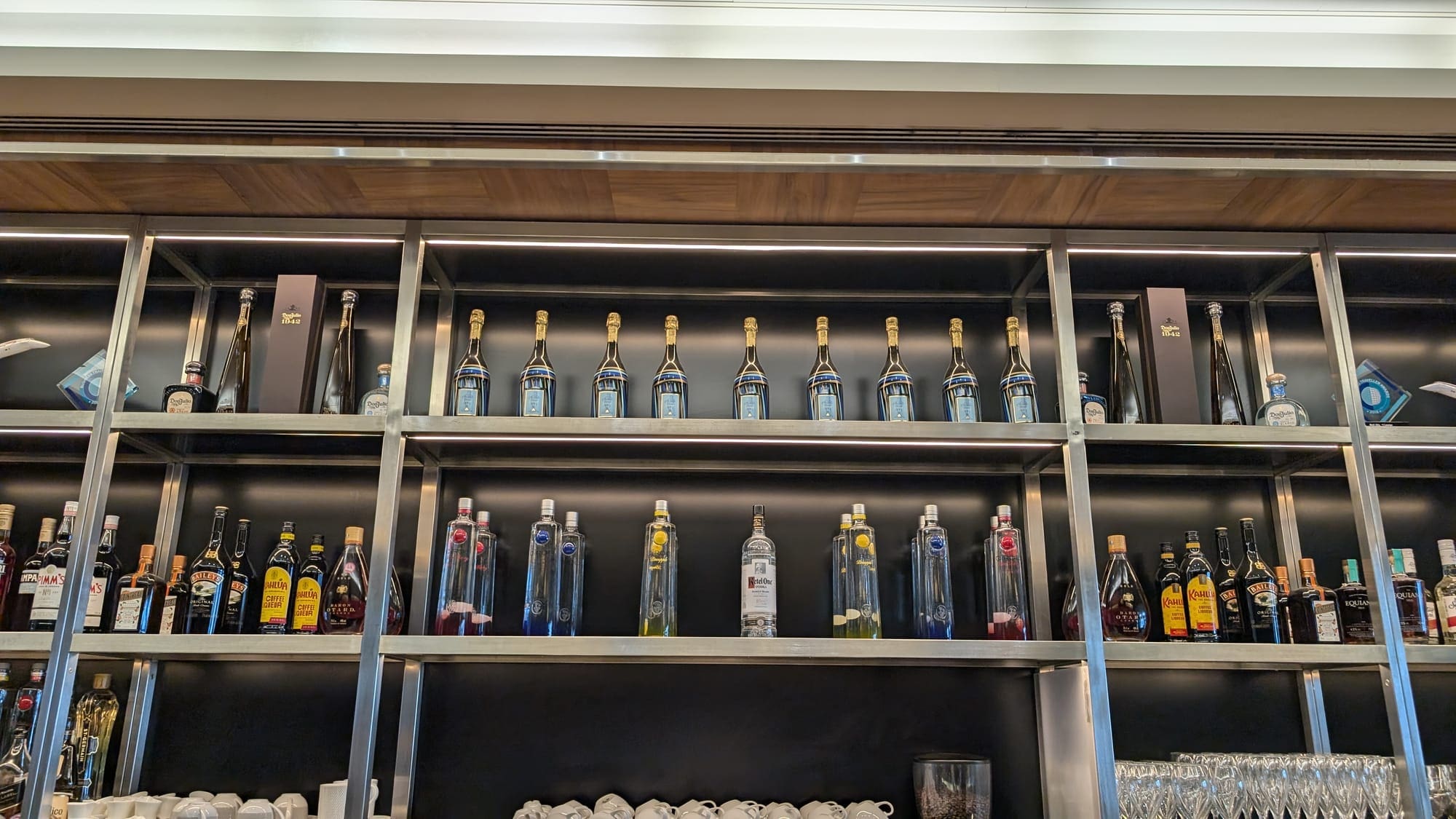 a shelf with bottles of liquid