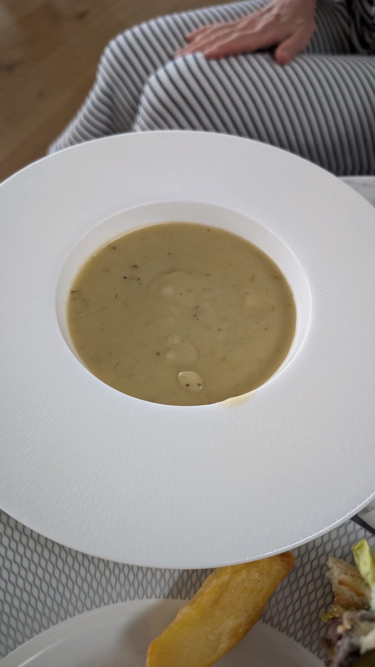 a bowl of soup on a plate