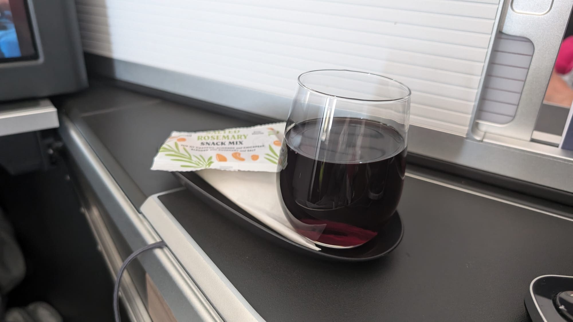 a glass of wine on a plate