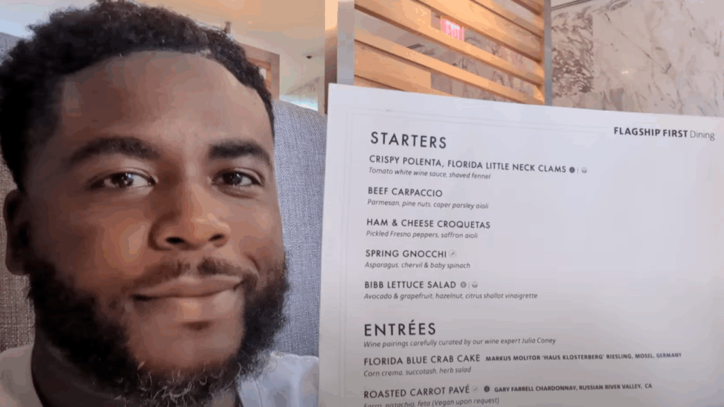 a man holding a menu