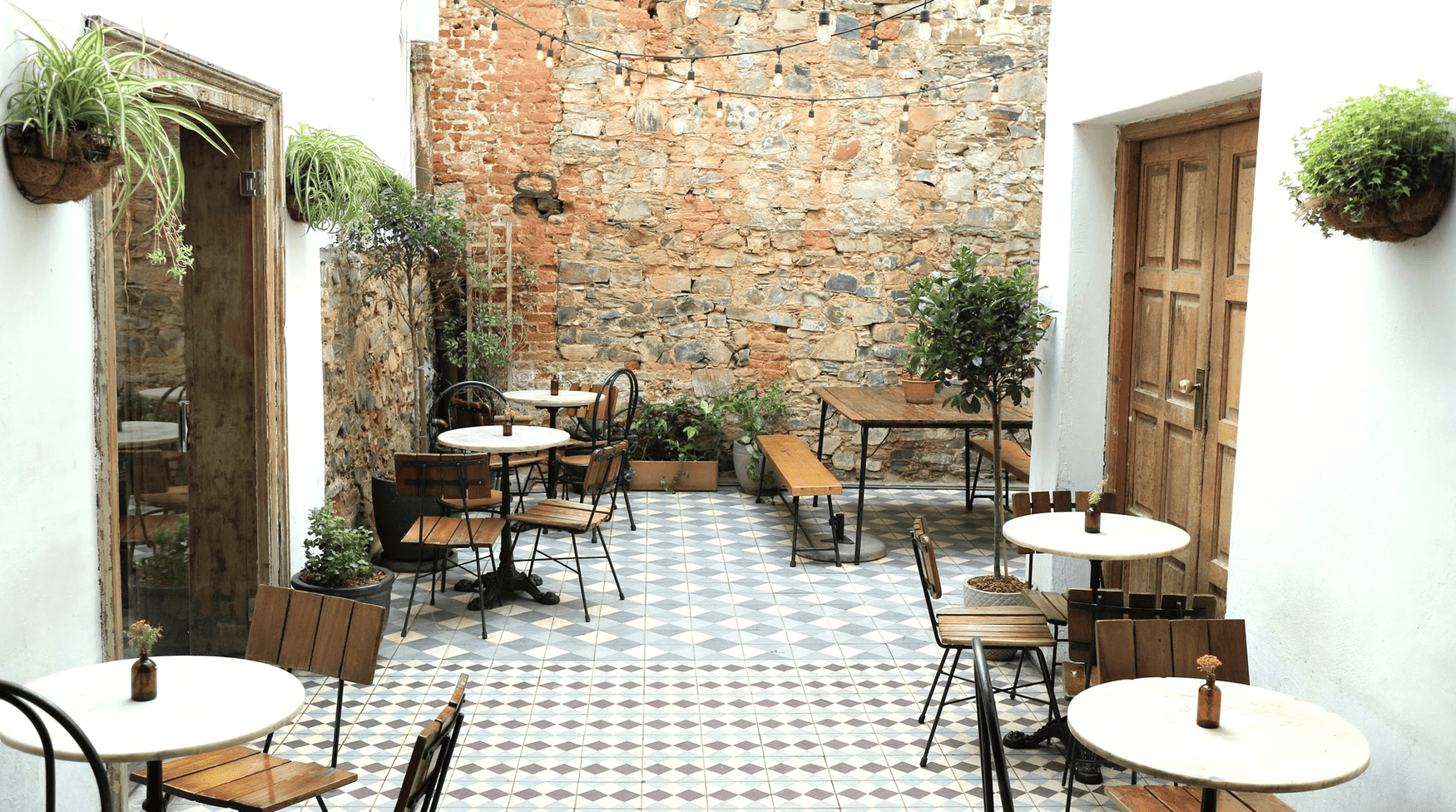 a patio with tables and chairs