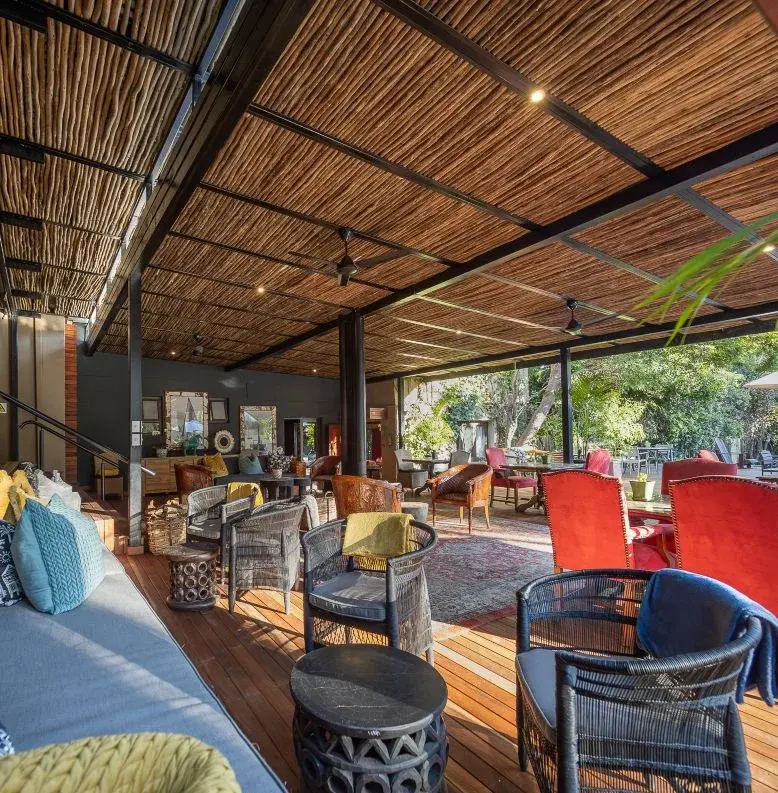 a patio with chairs and tables