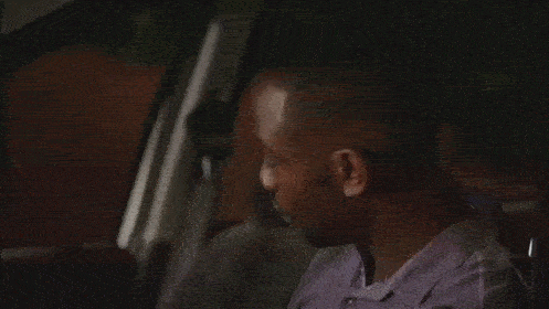 a man in a purple shirt