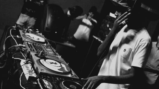 a man with headphones and a turntable
