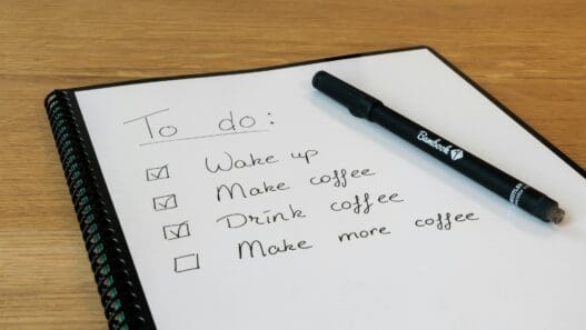 a notebook with a pen on it